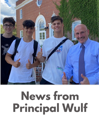  Principal Wulf with three students giving thumbs up